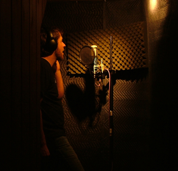 laying down vocal tracks